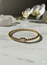 Aura Gold-Plated Beaded Bracelet with Crystal-Studded Rectangle Charm
(Alt Title: The Regal Bead & Crystal Bracelet – Gold Edition)