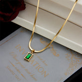 Elegant Emerald Green Rectangle Pendant Gold Snake Chain Necklace
Alternative: Vintage Emerald Green Zircon Necklace – 18K Gold Plated Snake Chain for Women
Short & Chic: The Malachite Green Square Pendant Necklace