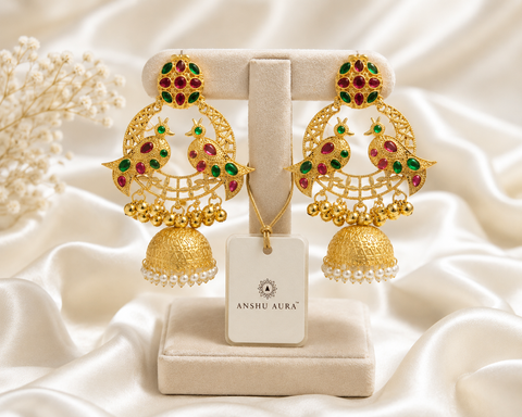 ANSHU AURA™ Peacock Heritage Jhumka Earrings – Premium Gold Finish with Ruby Green Stones & Pearl Dome