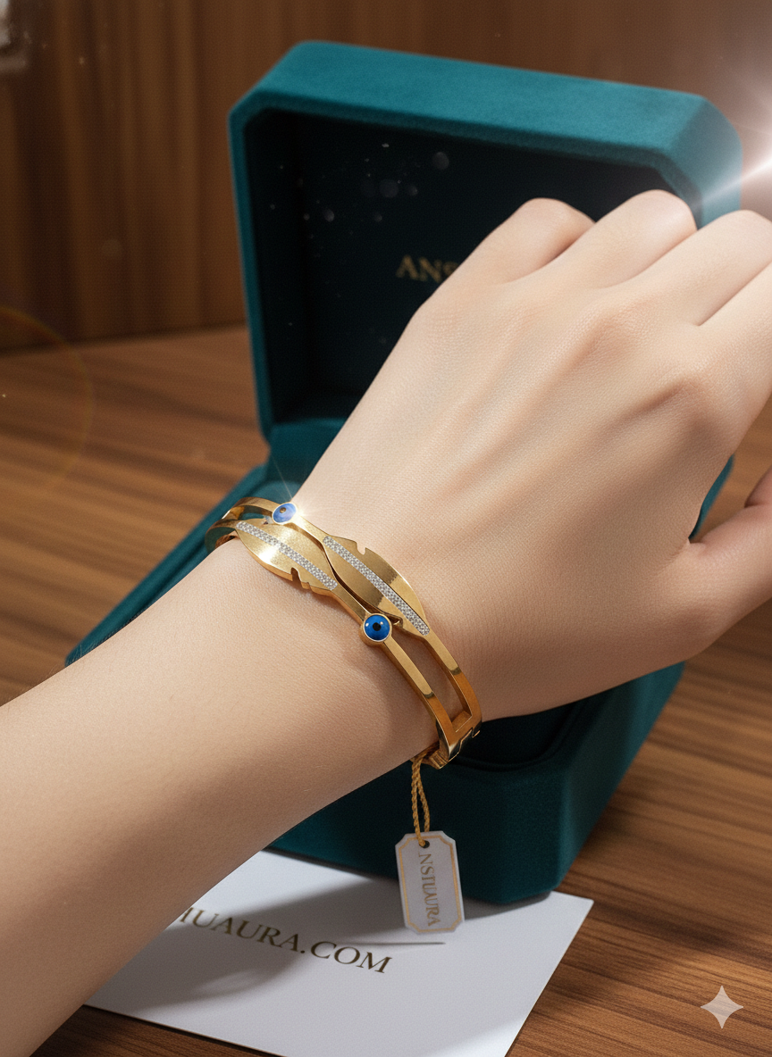 The Eternal Charm: 18K Gold-Plated Feather & Evil Eye Cuff Bracelet