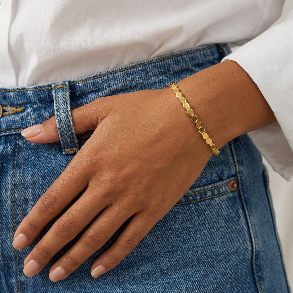 Elevate your style with the ANSHU AURA JEWELLERY Gold Plated Geometric Bracelet. Crafted from premium stainless steel with a luxurious gold-plated finish, this elegant bracelet offers a modern and minimal design perfect for every occasion. Lightweight, co
