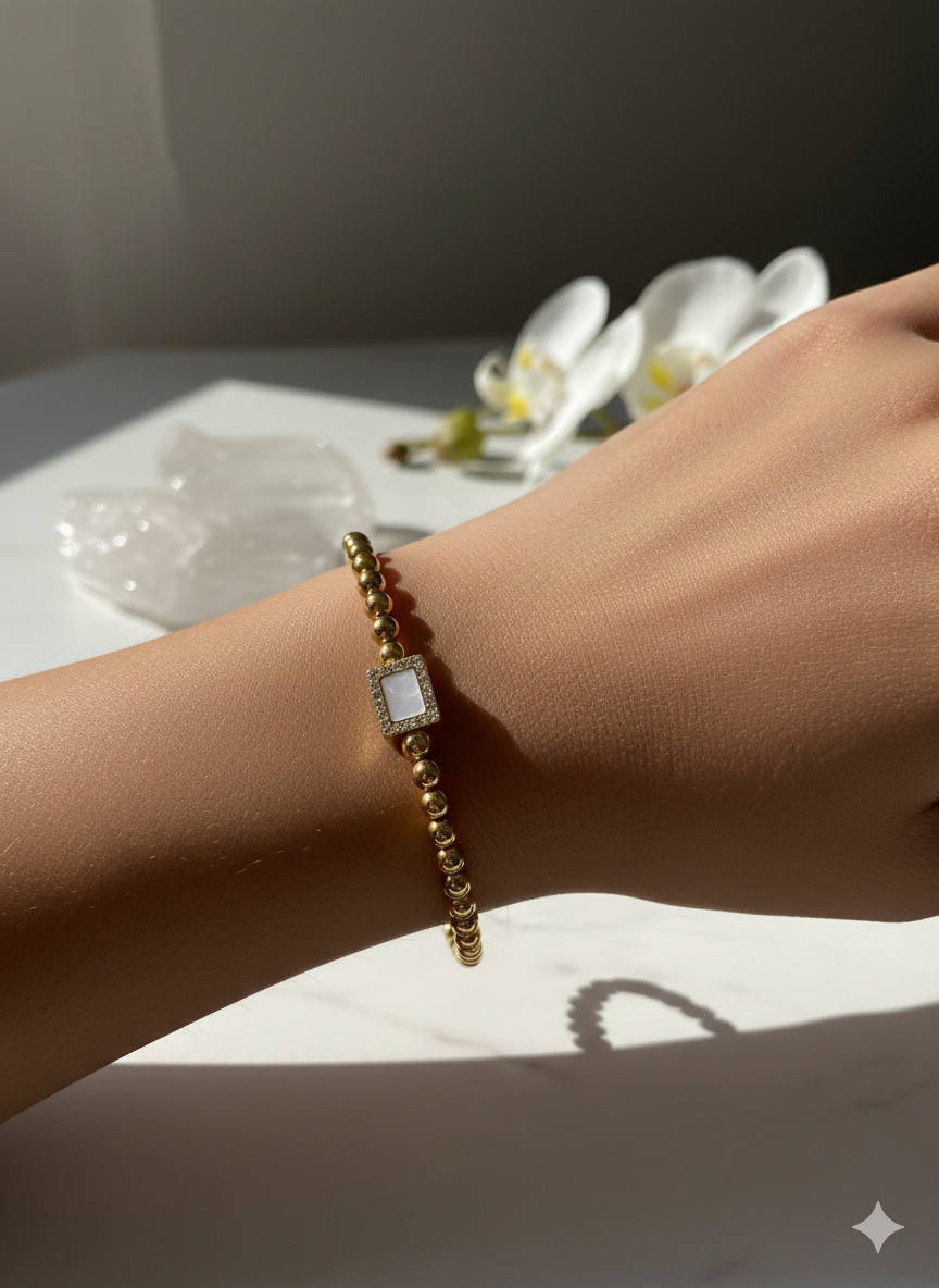 Aura Gold-Plated Beaded Bracelet with Crystal-Studded Rectangle Charm
(Alt Title: The Regal Bead & Crystal Bracelet – Gold Edition)