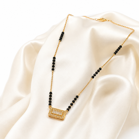 Elegant Black Beaded Gold
